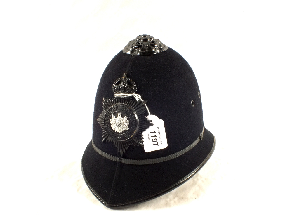 A Police helmet with Manchester Police plate (Kings Crown pre 1952)