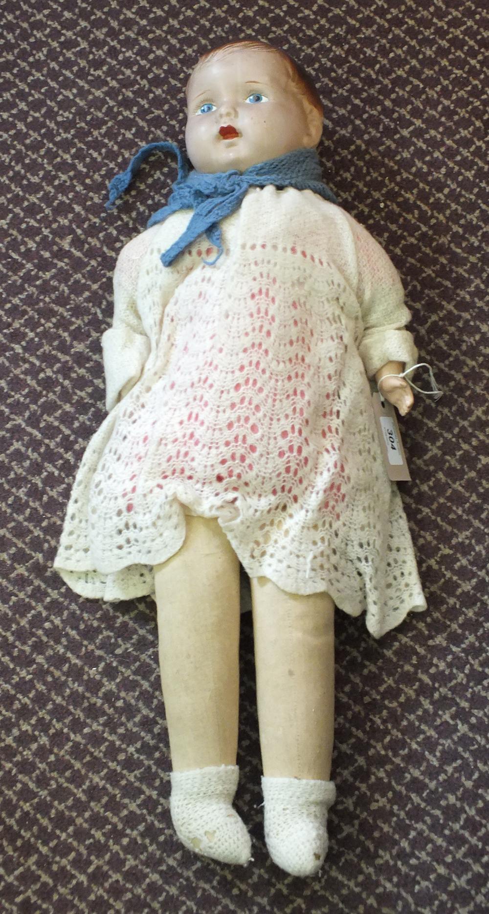 A composition dressed doll