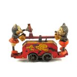 A tin plate Mickey and Minnie Mouse clockwork handcart,