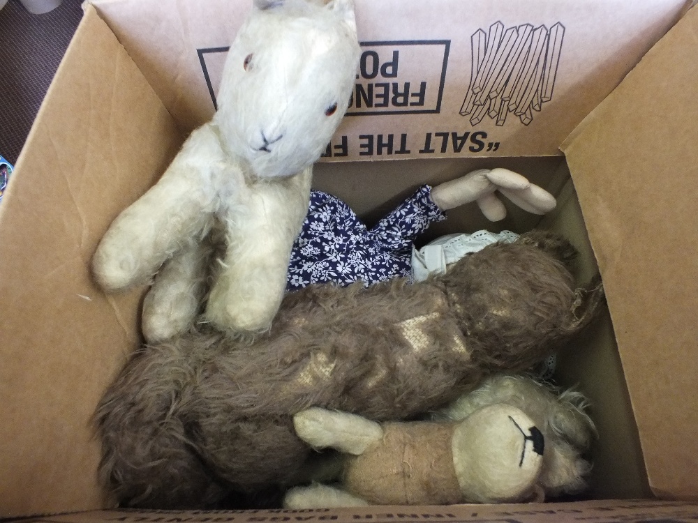 A composition doll and various soft toys