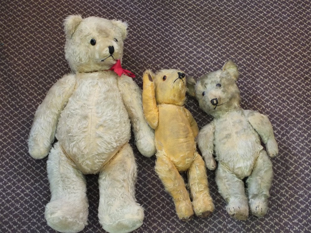 Three straw filled teddy bears,