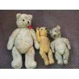 Three straw filled teddy bears,