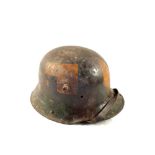 A WWI German (PATTERN) Stalhelm tin helmet in camo