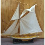 A wooden model yacht