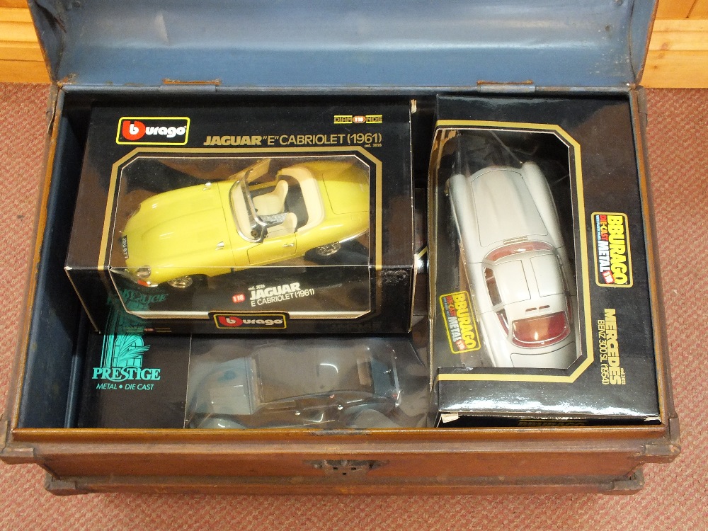 Five boxed Burago and Solido models