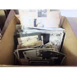 Two boxes of photographs in albums and loose,