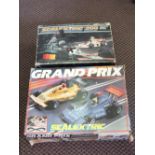 Two boxed Scalextric and a box of stamps and postcards etc