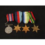 Four medals including the Pacific Star and War Medal