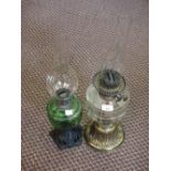 Two oil lamps, one Brass base and cut glass bowl,