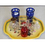 A pair of blue overlaid glass vases and cranberry and other scent bottles