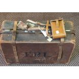 A 1930's leather suitcase and a folding camera