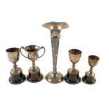 Four Silver trophy cups and a spill vase,