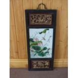 A Chinese porcelain panel of birds with character marks mounted in a parcel gilt carved frame with