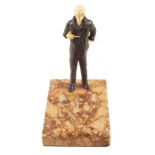 A Bronze of Tennyson holding a pipe with Ivory head and hands on rouge marble ashtray base,