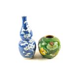 A 19th Century Chinese blue and white porcelain double gourd vase and a predominantly apple green