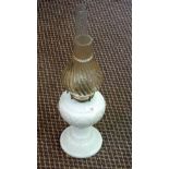 A white milk glass oil lamp