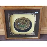 A framed Chinese gilt metal filigree and enamel dragon decorated dish