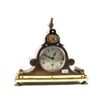A Brass cased Westminster striking mantel clock with bird finial