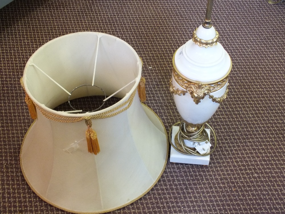 A substantial white marble table lamp with Ormolu rams head and floral appliques