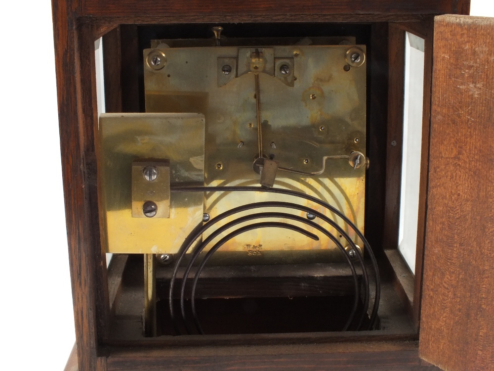 An Oak striking mantel clock with bevelled glass sides, dial marked T. - Image 2 of 2