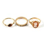 Three 9ct Gold rings to include one set with a cameo