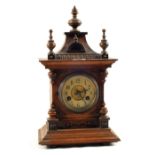 An Oak cased Junghams striking mantel clock