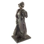 A Bronze of a lady in Victorian costume,