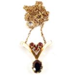 A 9ct Gold Garnet set pendant on chain