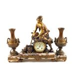 A French gilt metal clock garniture in the form of a kneeling maiden watering ducks with floral