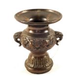 A Japanese Bronze small twin handle vase with bird and animal decoration,