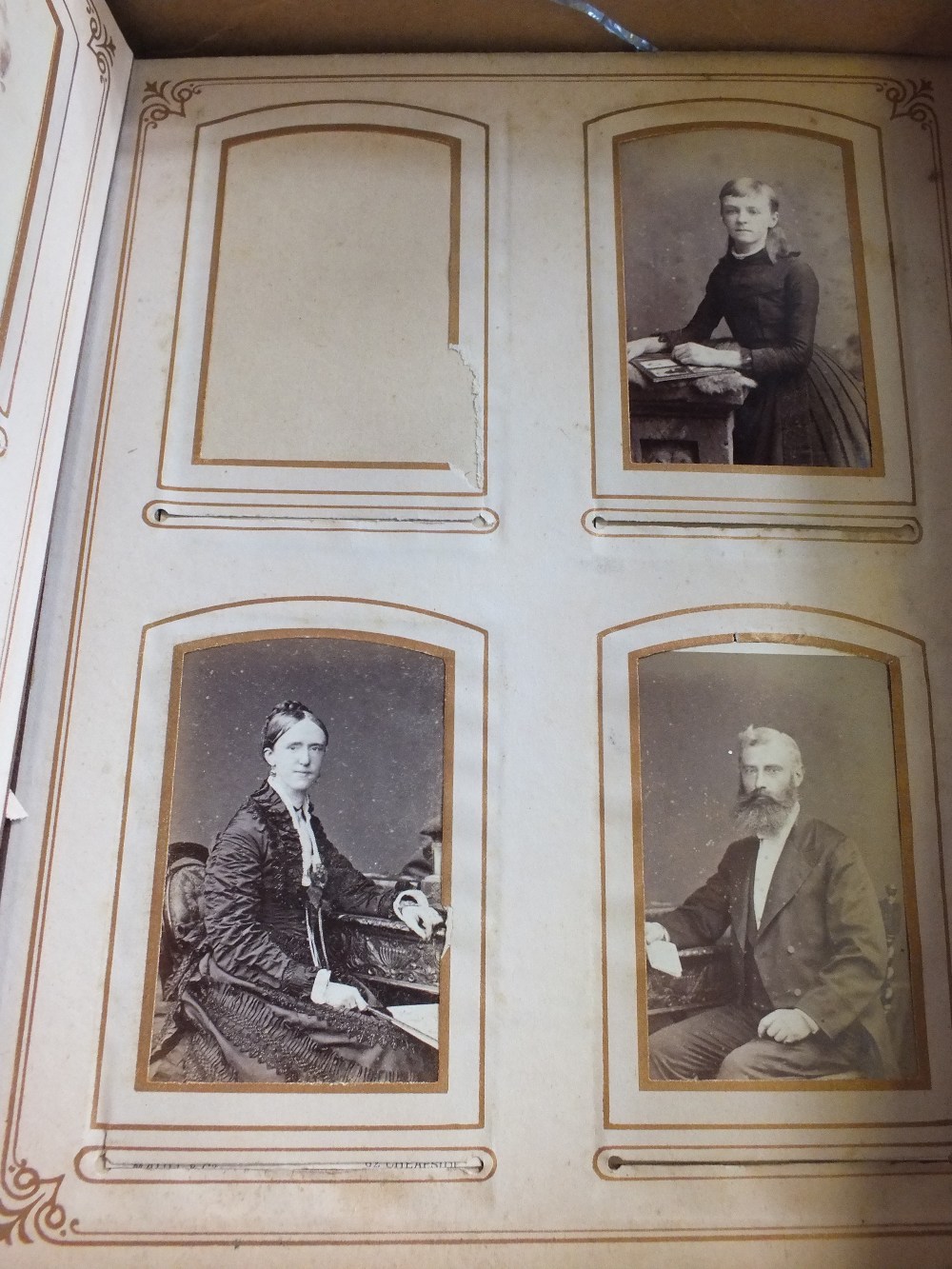 A Victorian photo album and various old photos