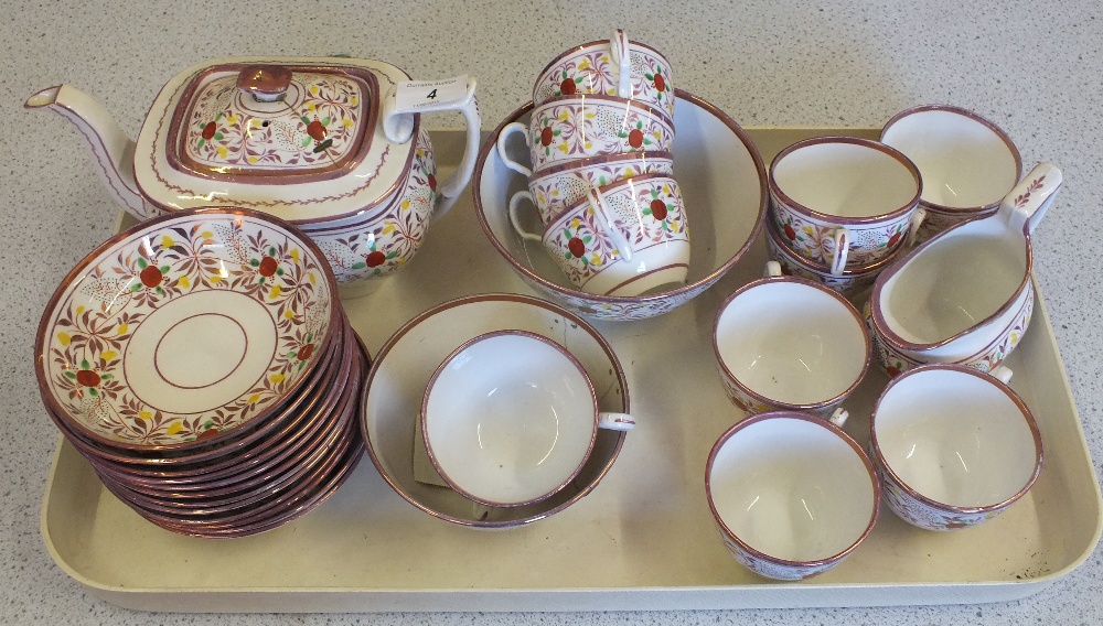 A 19th Century pink lustre and polychrome floral tea set