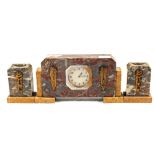 An Art Deco rouge marble clock garniture