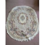 An oval floral Chinese rug