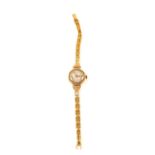 A 9ct Gold lady's wristwatch on plated strap