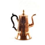 A large Georgian seamed Copper coffee pot with tapering body and shaped wooden handle,