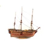 A large and well detailed wooden model ship, HMS Victory, with cannons, rigging and fixtures,