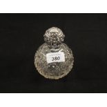 A Silver topped scent bottle,