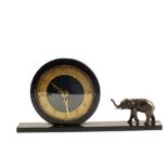 An Art Deco black marble effect mantel clock with spelter elephant mount