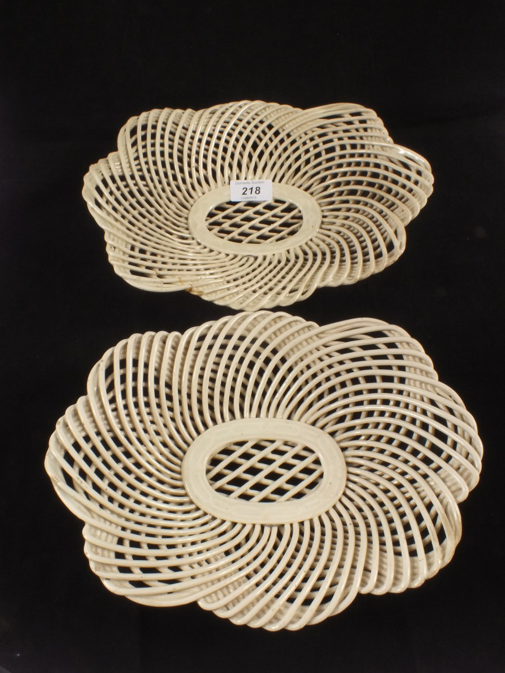 A pair of Leeds type creamware lattice work baskets,
