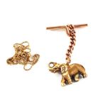 A 9ct Gold Elephant charm attached to a 9ct bar brooch,