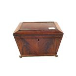 A 19th Century Mahogany sarcophagus shaped workbox with lion mask handles and claw feet