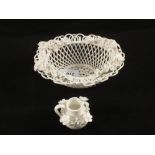 A Derby white glazed lattice work porcelain floral basket and a small jug with floral decoration,