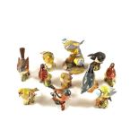 Ten Beswick and one Royal Worcester bird ornaments