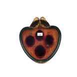 A Victorian ebonised heart shaped miniature frame with gilt metal cherub and floral decoration