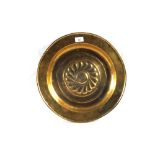 A 16th Century Nurenberg Brass alms dish with gadrooned boss,