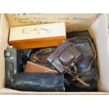 Various vintage cameras and accessories