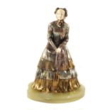A bimetal figure of a lady in crinoline dress with Ivory face and hands, signed Marquet, No.