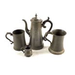 Three pewter tankards and a pewter coffee pot