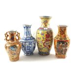 Four modern Chinese polychrome and blue and white vases (one repaired)